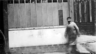 Man Walking Around a Corner Trailer