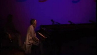 The Well-Tuned Piano in the Magenta Lights Trailer