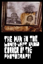 The Man in the Lower-Left Hand Corner of The Photograph The Man in the Lower-Left Hand Corner of The Photograph