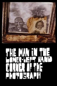 The Man in the Lower-Left Hand Corner of The Photograph (1997)