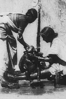 An Indian Washing the Baby Trailer