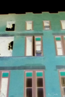 Brick Building with Red and Green Windows Trailer