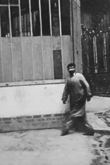 Man Walking Around a Corner Trailer