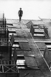 Man Walking Down the Side of a Building Trailer
