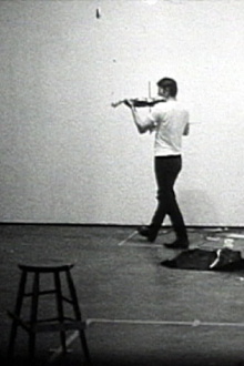 Playing a Note on the Violin While I Walk Around in the Studio Trailer