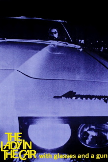 The Lady in the Car with Glasses and a Gun Trailer
