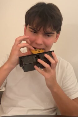 a chinese man eats a biscuit (2023)